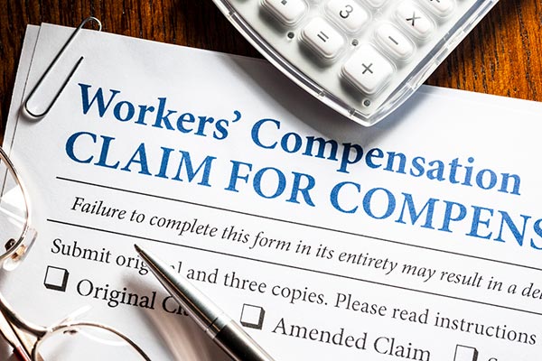 Workers Compensation Attorney Filing Out Form